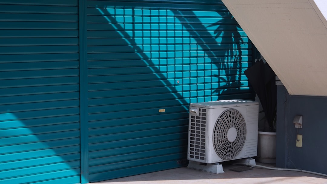Clean modern air conditioning condenser unit installed professionally